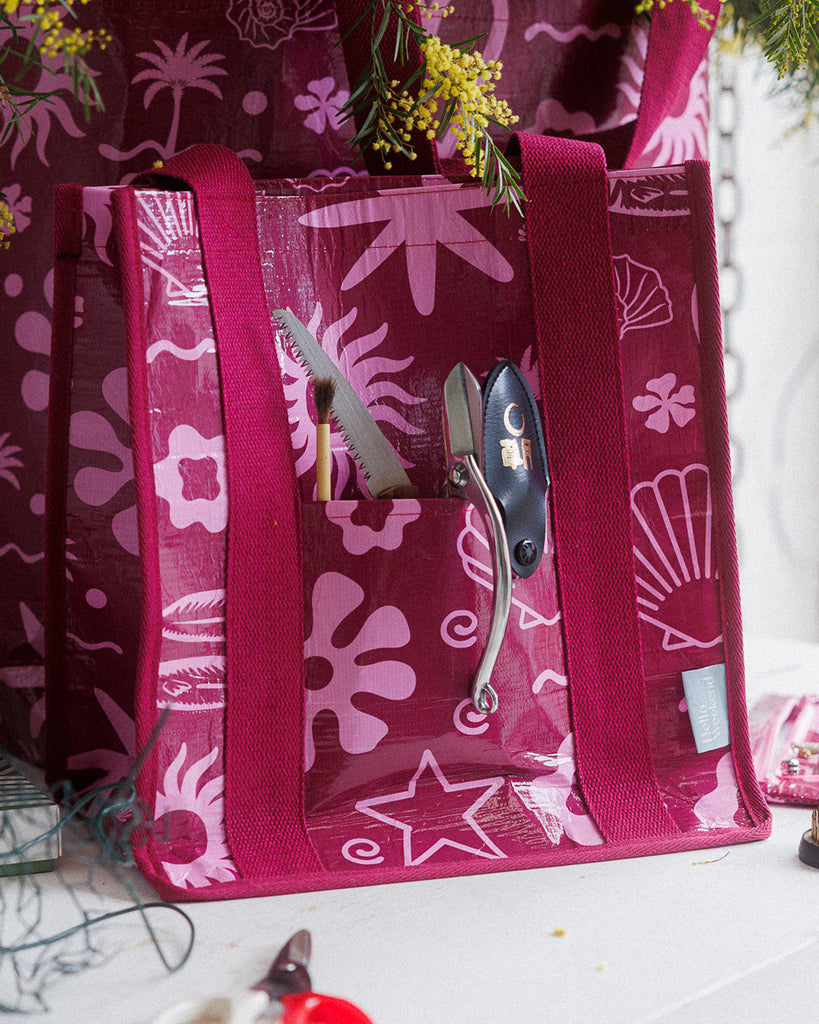 A square canvas tote bag with bright pink patterns on maroon colour.  Layla Print - Daily Bag - Reusable bags online | Weekender bags | Shopper bags | Pouches  Hello Weekend Beige canvas handles | Beach Bags