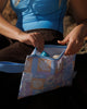 A handy rectangle shaped zippered pouch in a blue, purple and orange print. Lizzie print - Good To Go Pouch - Reusable bags online | Daily bags | Shopper bags | Weekender bags | Hello Weekend Pouch