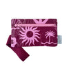 A small zippered pouch with a maroon wrist strap, featuring a palm tree and sun mixed pattern of bright pink shapes on a maroon colour. A small fabric tag on the right reads Hello Weekend. Layla Print - Phone Pouch - Reusable bags online | Daily bags | Shopper bags | Weekender bags  Hello Weekend