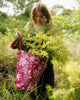 A Hello Weekend magenta tote bag with a pink and white ocean-themed pattern featuring seashells, starfish, waves, and a heart with two sets of maroon cotton canvas straps. Layla Print - Weekender Bag - Reusable bags online | Daily bags | Shopper bags | Pouches  Hello Weekend Beige canvas handles | Beach Bags