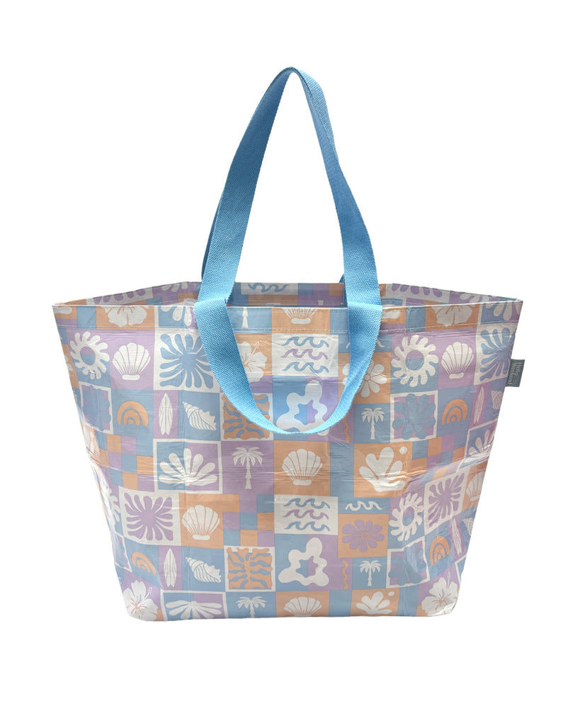 A Hello Weekend large bag with a pastel patchwork pattern featuring beach motifs like seashells, palm trees, and waves in lavender, blue, orange, and white, with light blue handles. Lizzie Print - Weekender Bag - Reusable bags online | Daily bags | Shopper bags | Pouches  Hello Weekend Beige canvas handles | Beach Bags